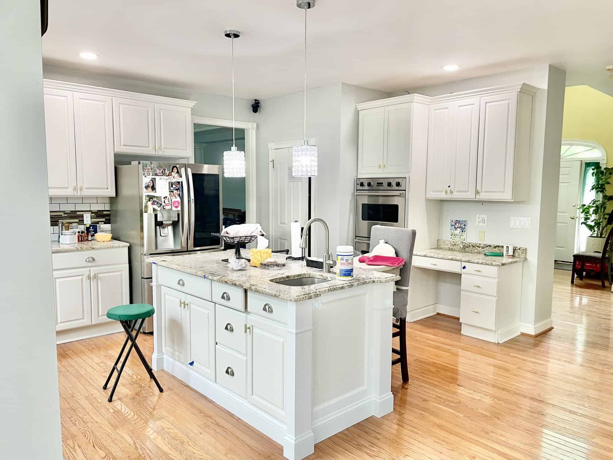 spacious kitchen with an island and cabinets, Preventing Paint Wear on Cabinets